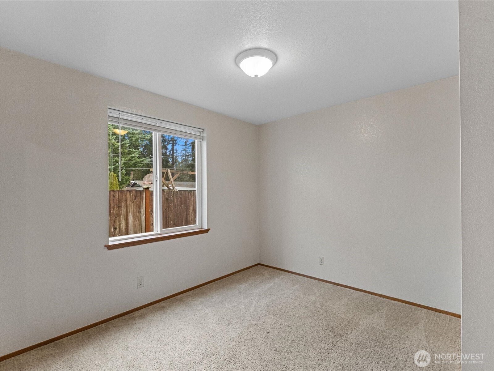 13411 Meadow Road Everett, WA 98208 - Photo 11 of 40 an empty room with a window