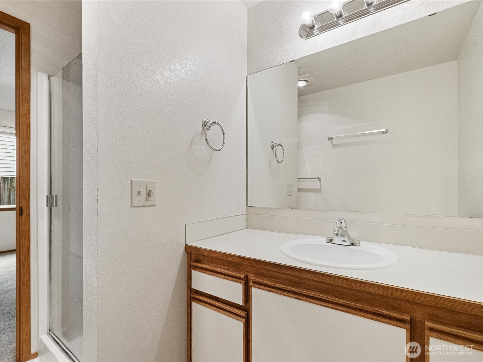 13411 Meadow Road Everett, WA 98208 - Photo 17 of 40 a bathroom with a sink and a mirror