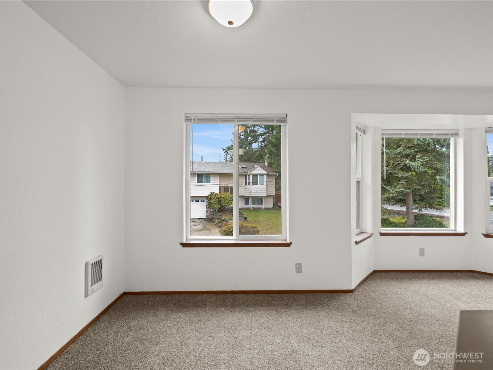 13411 Meadow Road Everett, WA 98208 - Photo 21 of 40 an empty room with windows