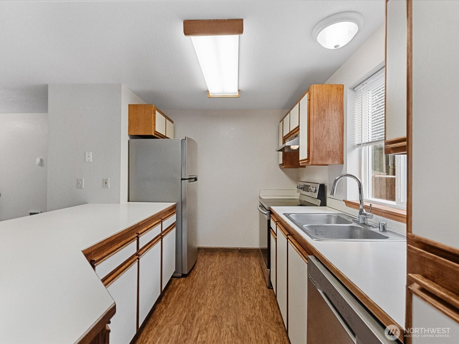13411 Meadow Road Everett, WA 98208 - Photo 25 of 40 a kitchen that has a sink and a stove