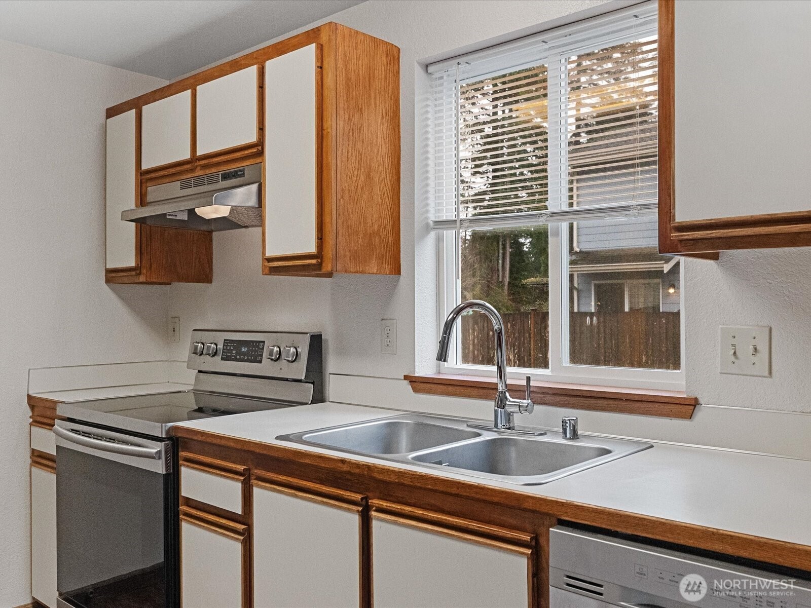 13411 Meadow Road Everett, WA 98208 - Photo 27 of 40 a kitchen that has a sink and a window