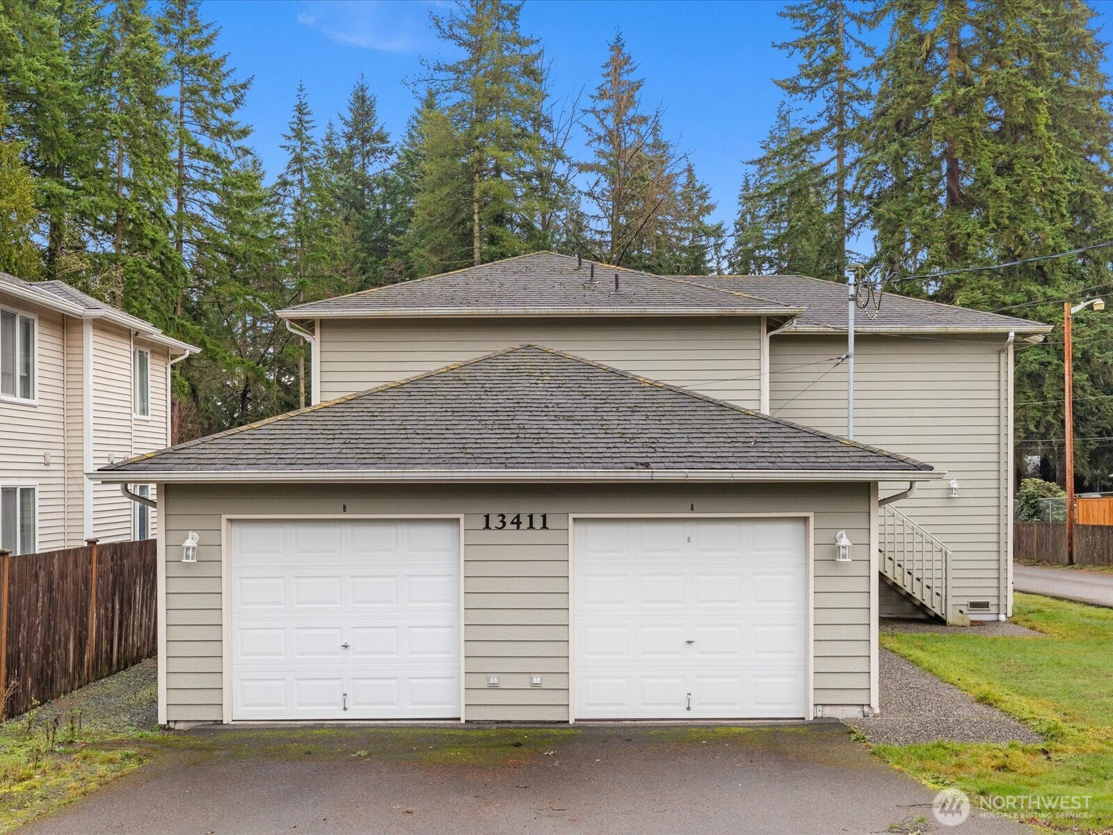 13411 Meadow Road Everett, WA 98208 - Photo 8 of 40 a front view of a house with garage