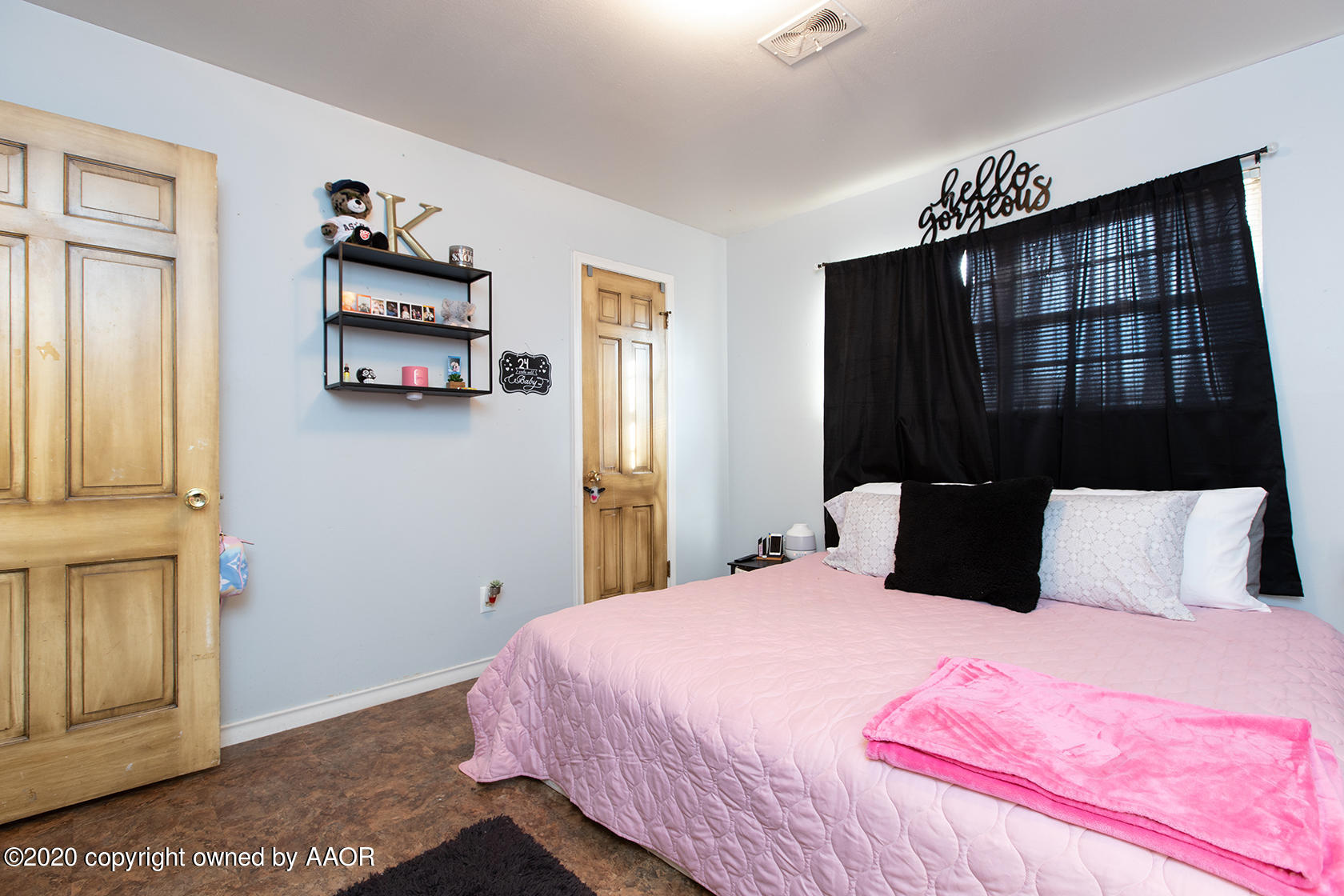 6017 Calumet Road Amarillo, TX 79106 - Photo 19 of 31 a bedroom with a bed and a painting on the wall