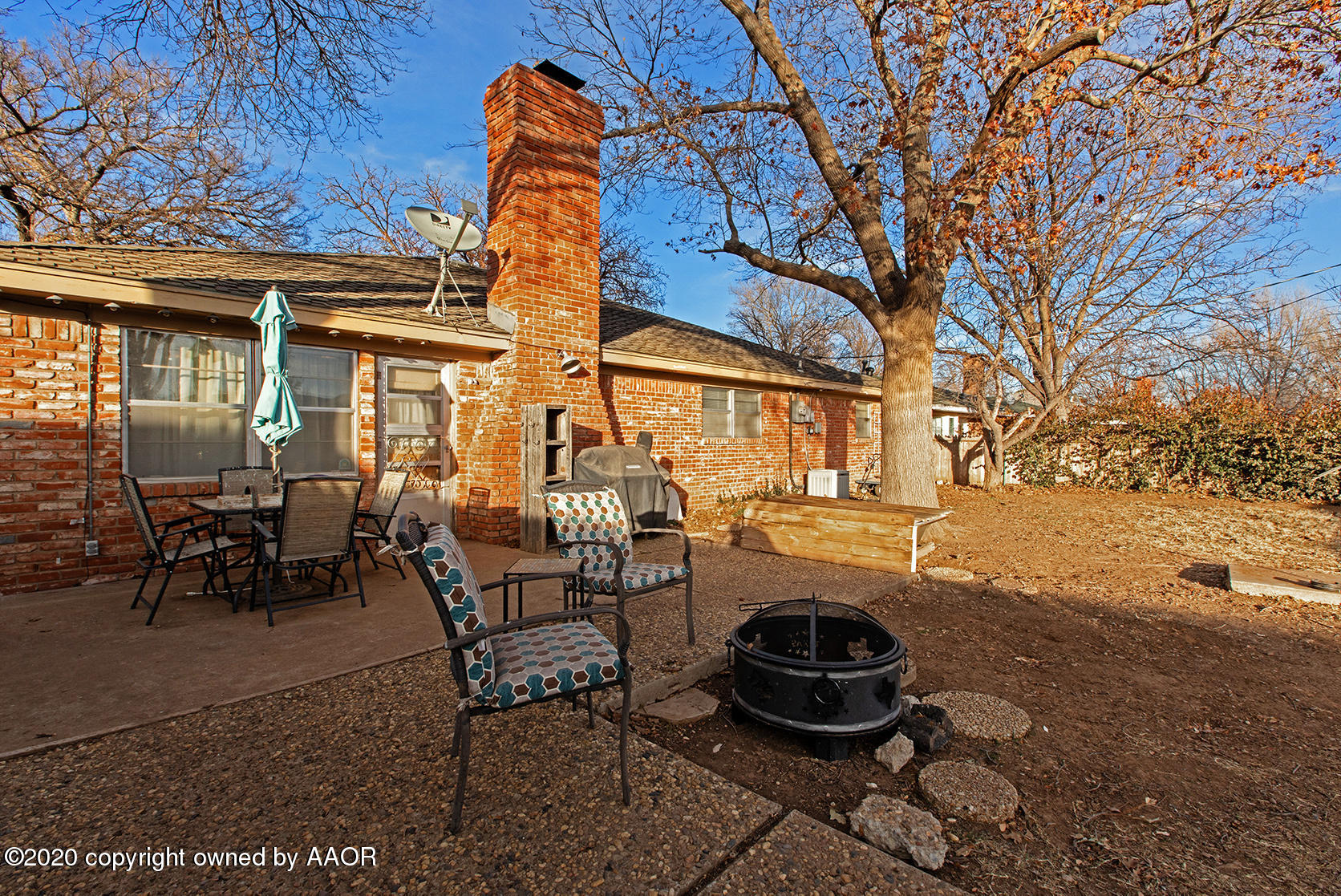 6017 Calumet Road Amarillo, TX 79106 - Photo 29 of 31 a backyard of a house with yard fire pit and outdoor seating
