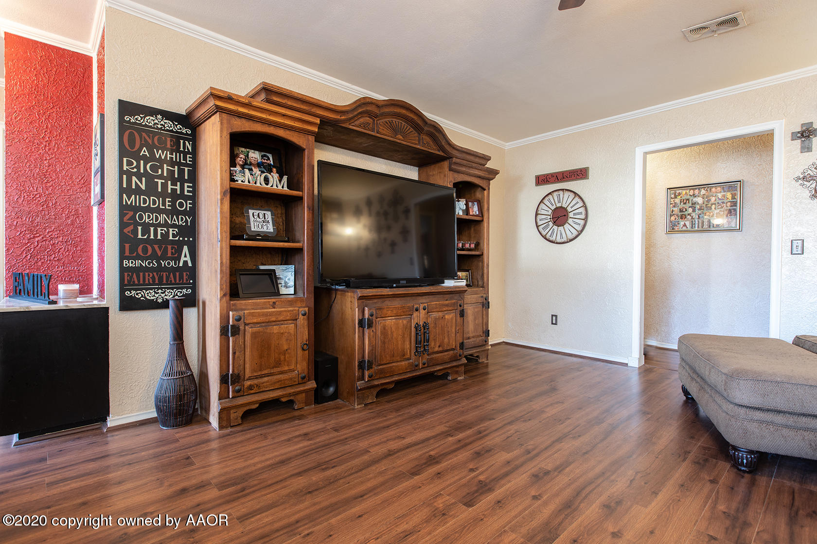 6017 Calumet Road Amarillo, TX 79106 - Photo 3 of 31 a living room with furniture and a flat screen tv