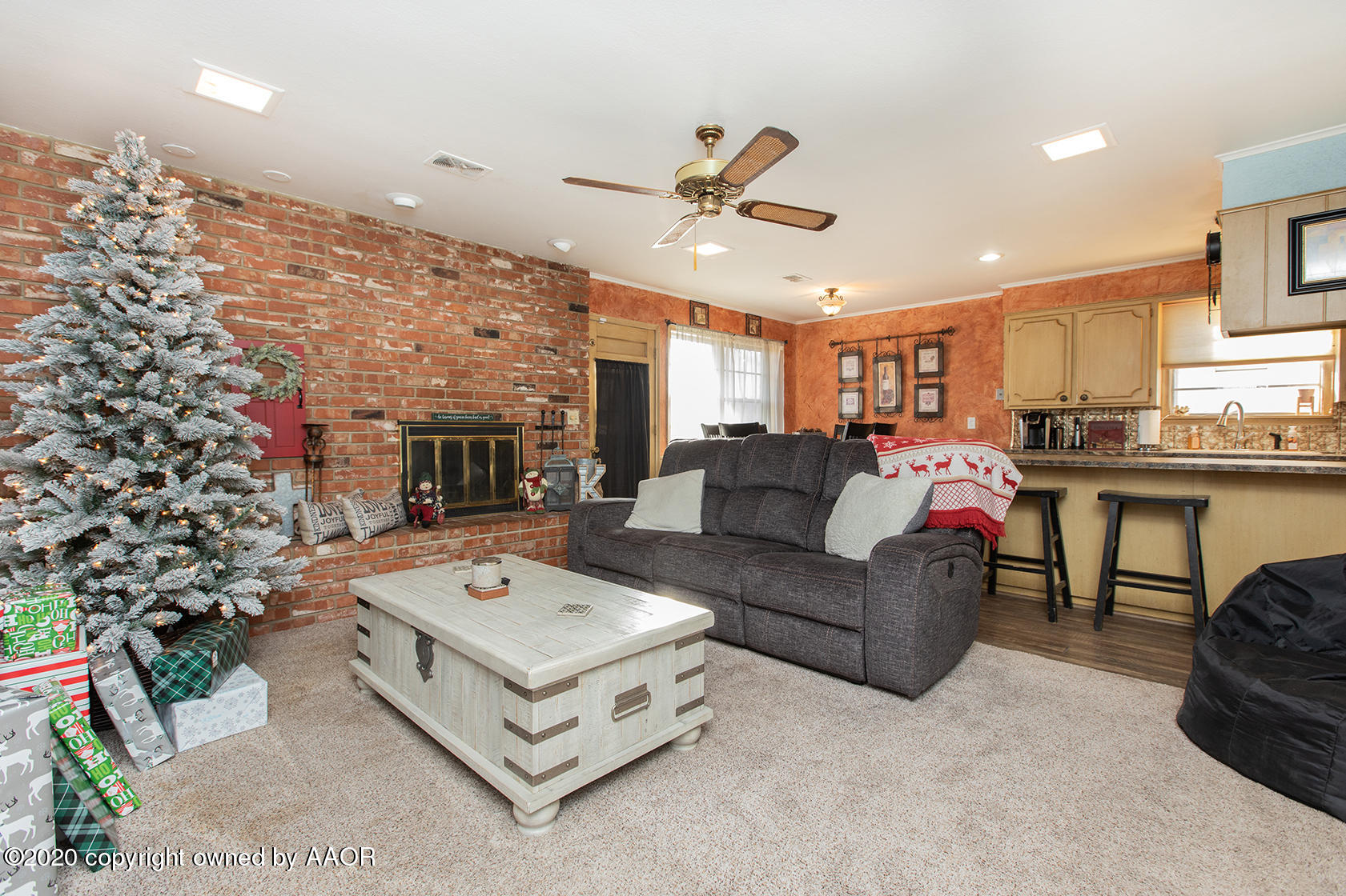 6017 Calumet Road Amarillo, TX 79106 - Photo 5 of 31 a living room with furniture and a chandelier