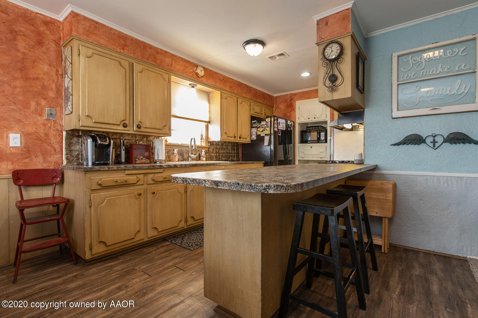 6017 Calumet Road Amarillo, TX 79106 - Photo 8 of 31 a kitchen with cabinets and chairs