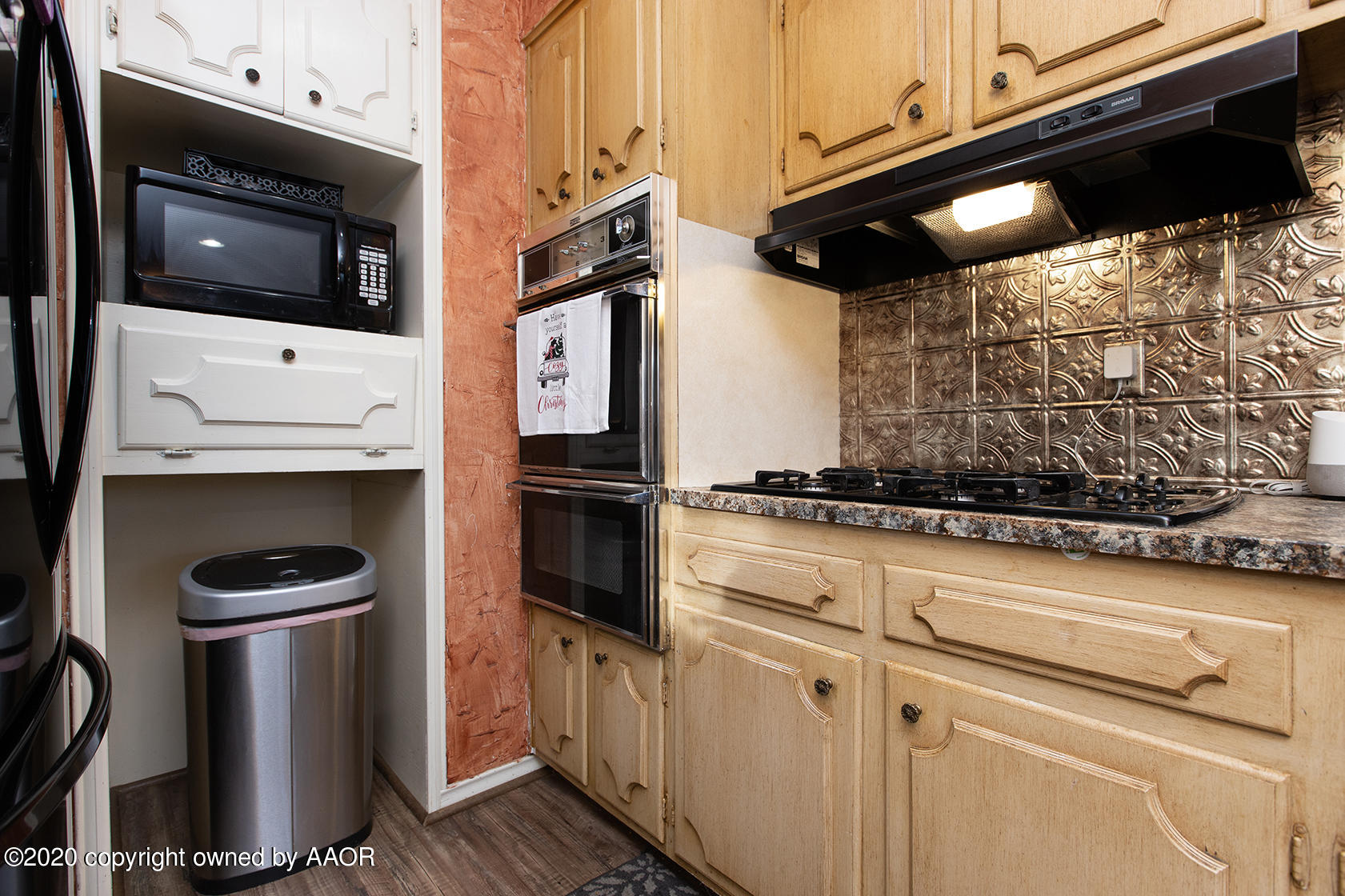 6017 Calumet Road Amarillo, TX 79106 - Photo 10 of 31 a kitchen with stainless steel appliances a refrigerator and a stove top oven
