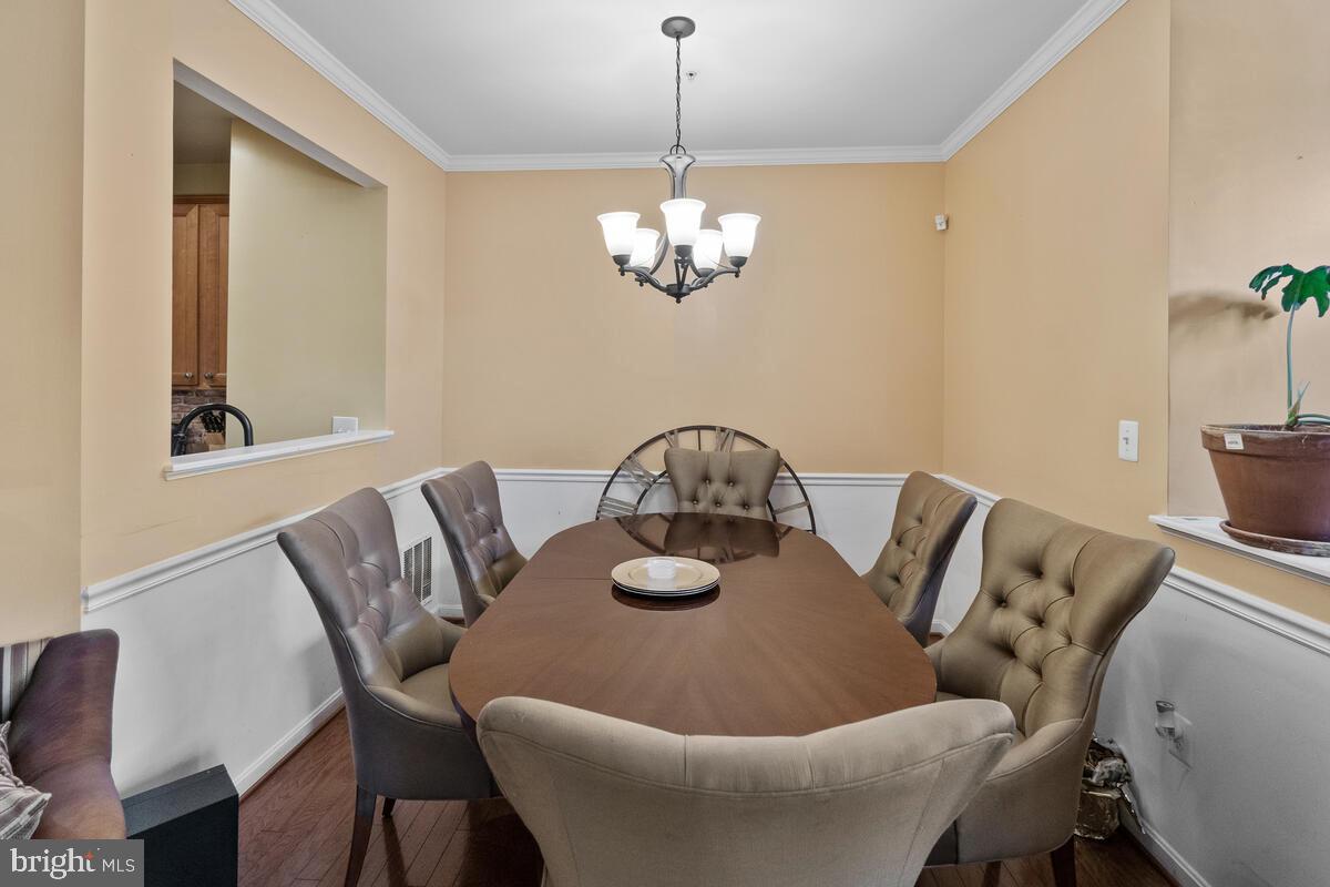 112 Featherstone Place Frederick, MD 21702 - Photo 8 of 27 Host holiday meals in this dining room.