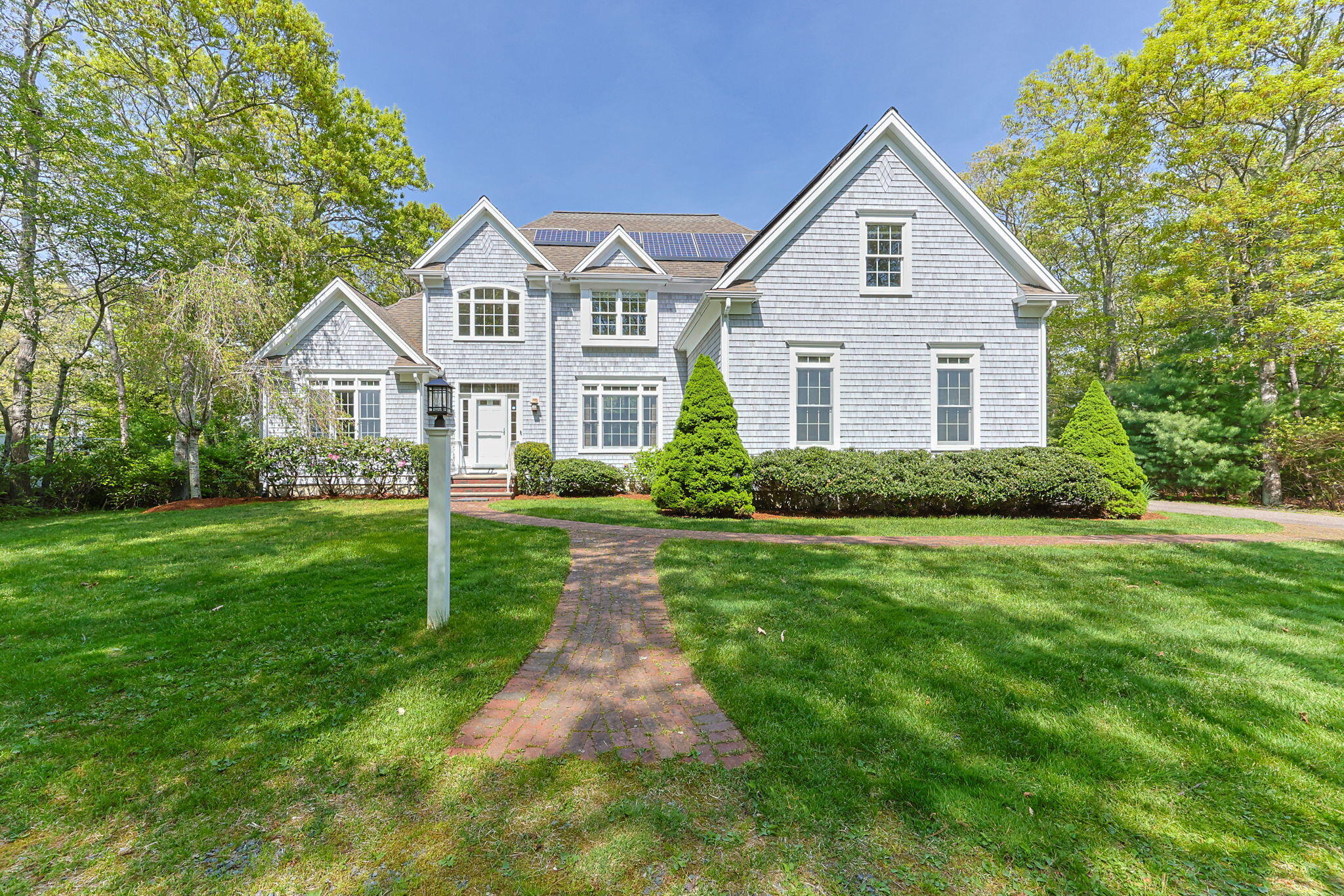 17 Payamps Road Mashpee, MA 02649 - Photo 2 of 72 a front view of house with yard and green space