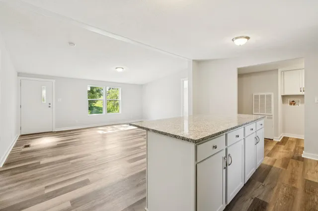 a view of a kitchen cabinets and wooden floor
