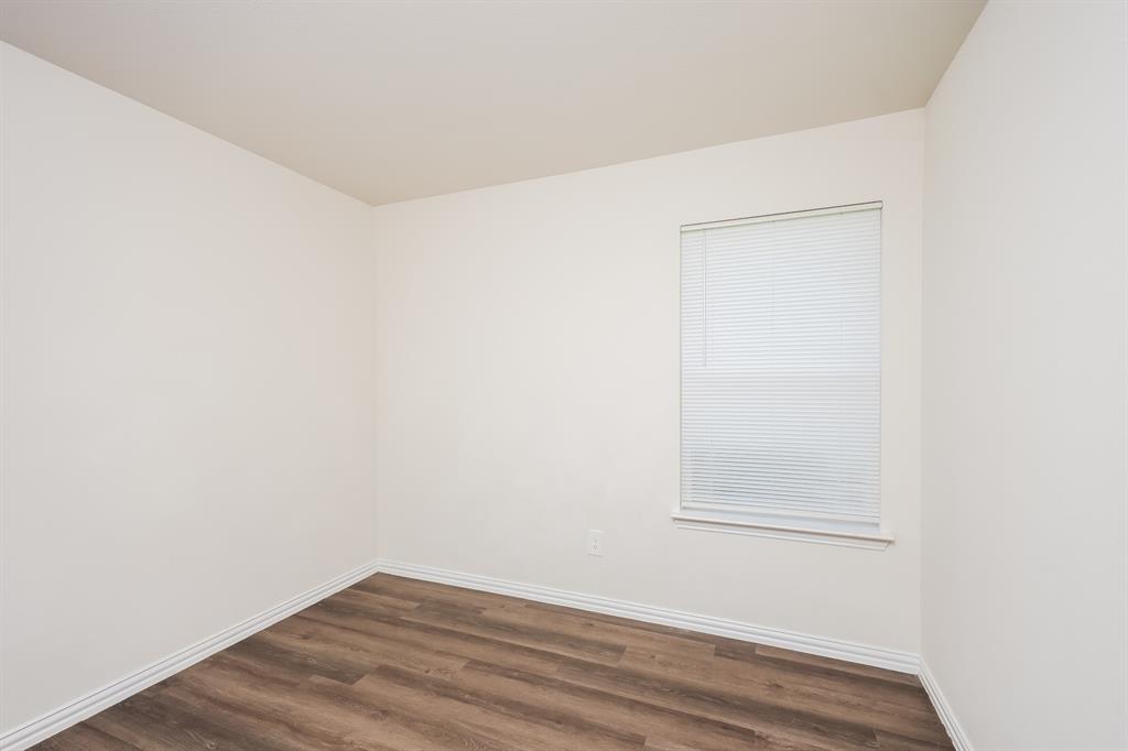 433 Shorty Street Mabank, TX 75147 - Photo 14 of 21 Unfurnished room with baseboards and dark wood finished floors