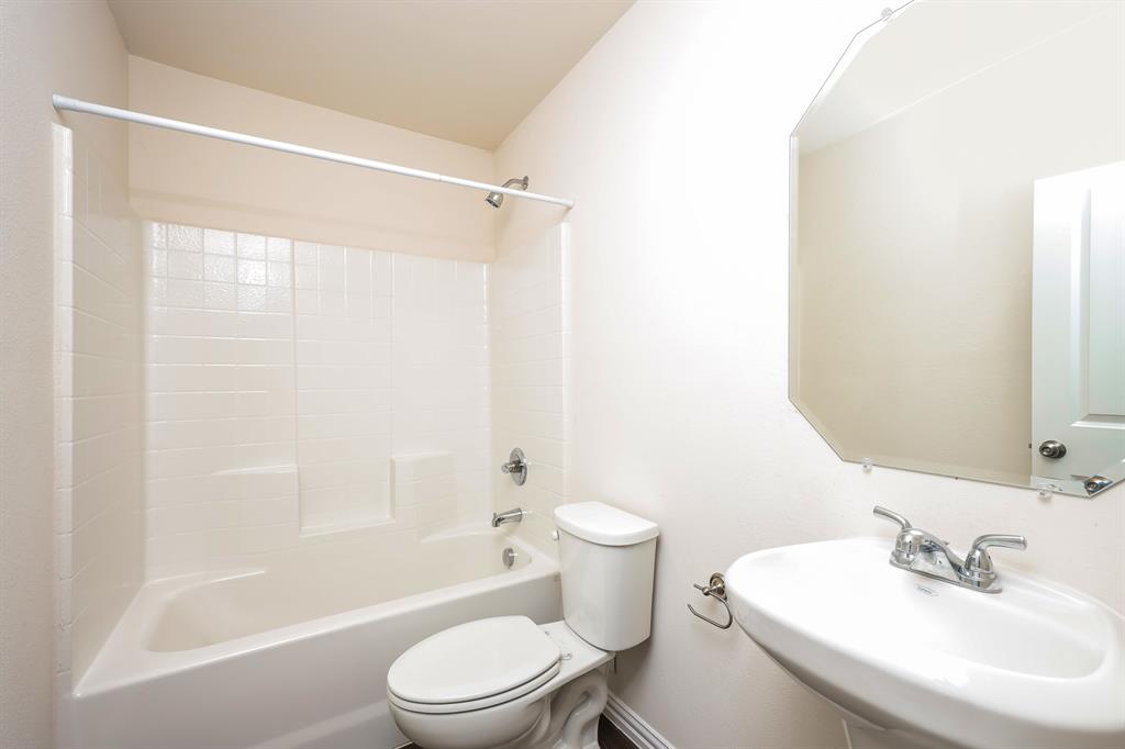 433 Shorty Street Mabank, TX 75147 - Photo 17 of 21 Full bath featuring toilet, shower / tub combination, and a sink