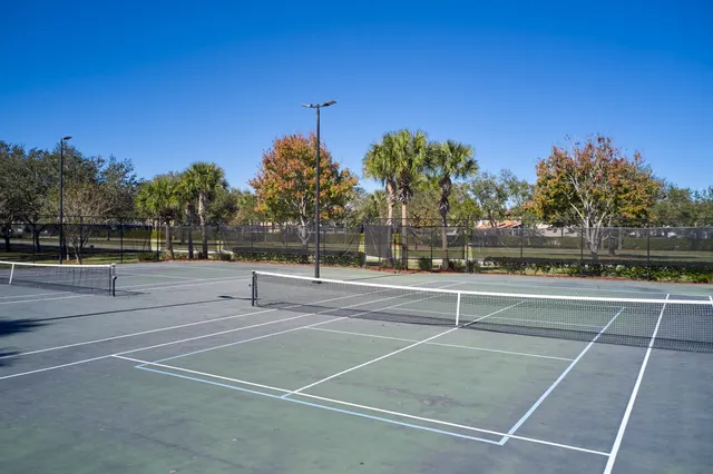 a view of a swimming pool with a lounge chair