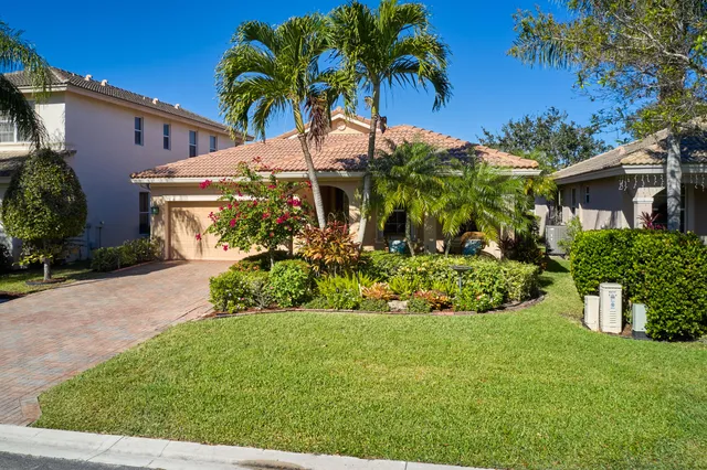 a view of a garden with a house