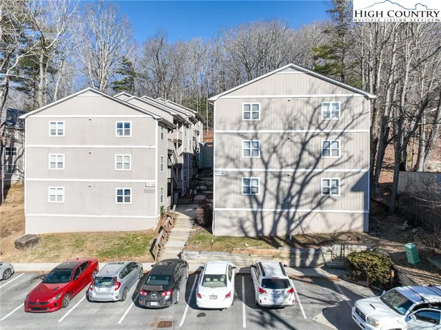 a view of a car park in front of house