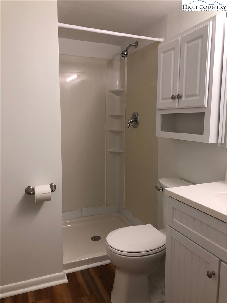 229 East King Street, Unit 9(1I) Boone, NC 28607 - Photo 9 of 19 a bathroom with a shower a toilet and a sink