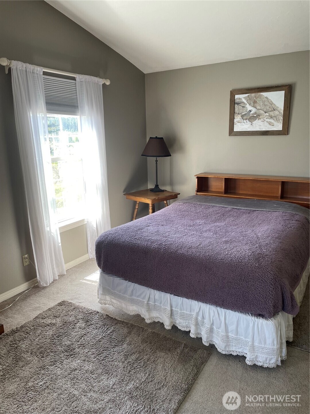 492 Pine Creek Road Tonasket, WA 98855 - Photo 13 of 37 a bedroom with a bed and a window