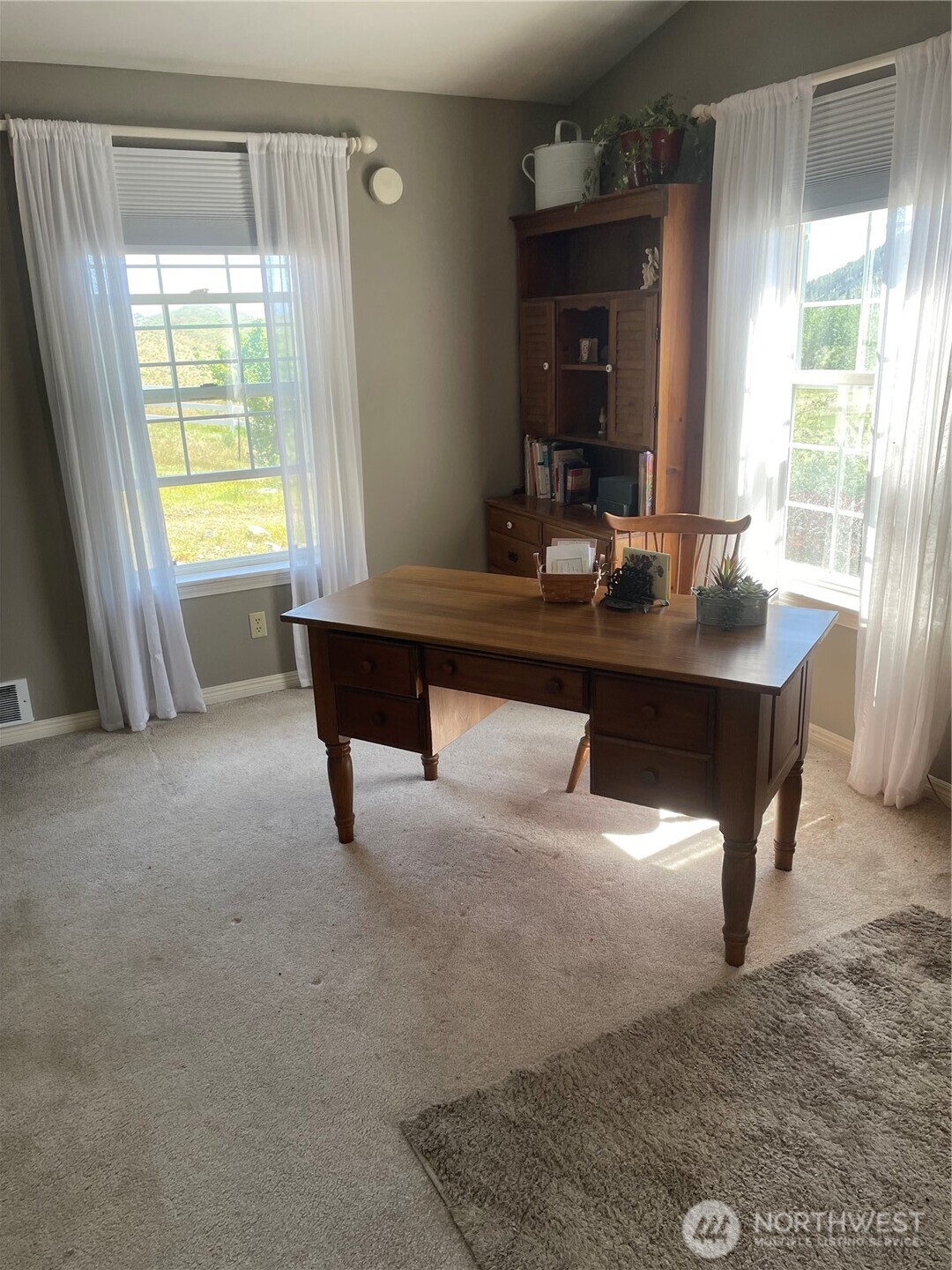 492 Pine Creek Road Tonasket, WA 98855 - Photo 15 of 37 a view of a room with a large window and table chair