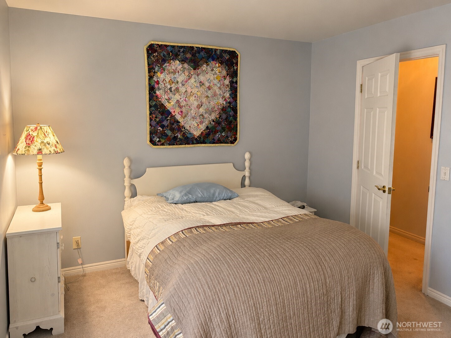 492 Pine Creek Road Tonasket, WA 98855 - Photo 17 of 37 a bedroom with a bed and a painting on the wall