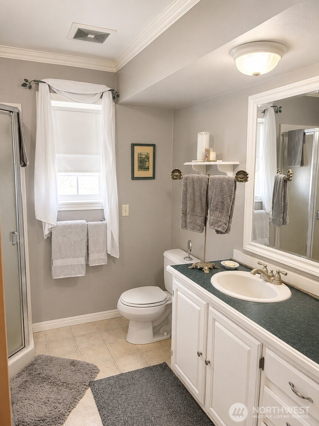 492 Pine Creek Road Tonasket, WA 98855 - Photo 18 of 37 a bathroom with a granite countertop sink toilet and shower