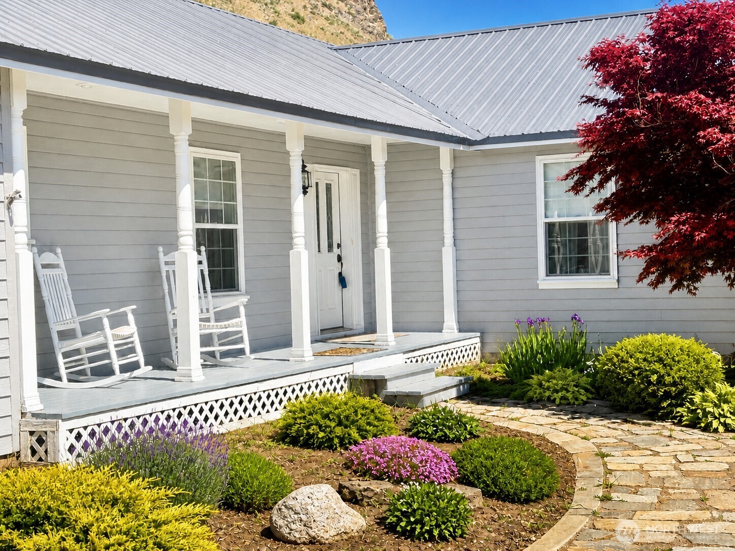 492 Pine Creek Road Tonasket, WA 98855 - Photo 2 of 37 a front view of a house
