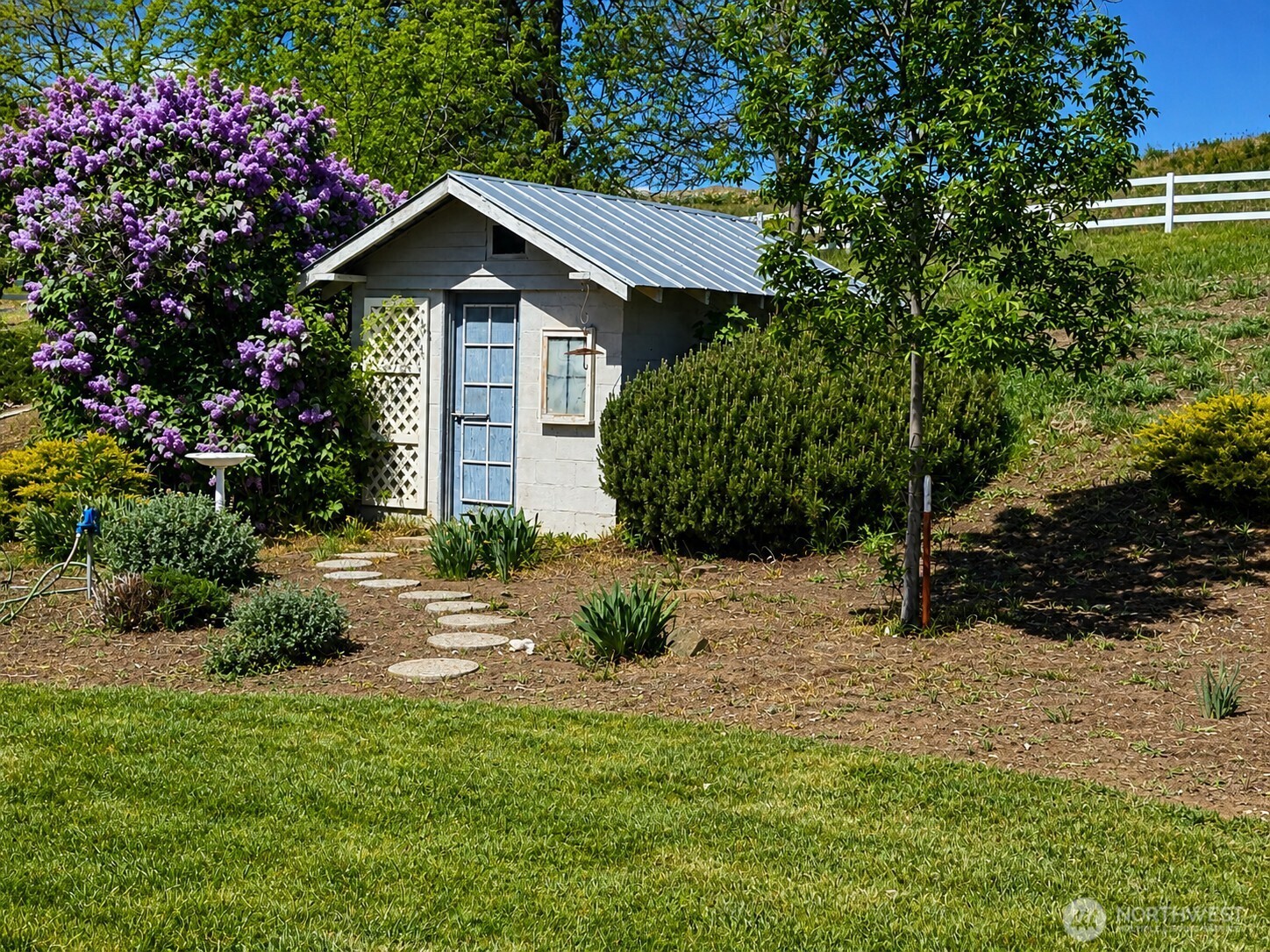 492 Pine Creek Road Tonasket, WA 98855 - Photo 25 of 37 a view of a house with a yard