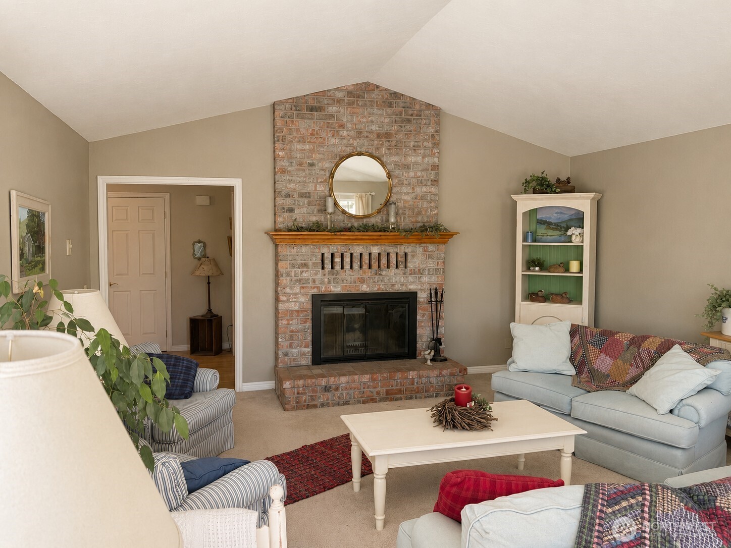 492 Pine Creek Road Tonasket, WA 98855 - Photo 5 of 37 a living room with furniture and a fireplace