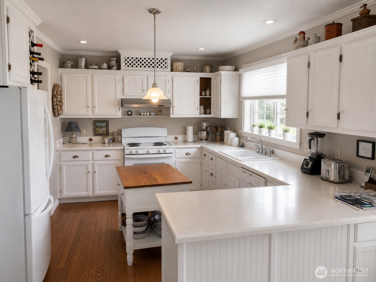 492 Pine Creek Road Tonasket, WA 98855 - Photo 6 of 37 a kitchen with kitchen island granite countertop a sink a counter space appliances and cabinets