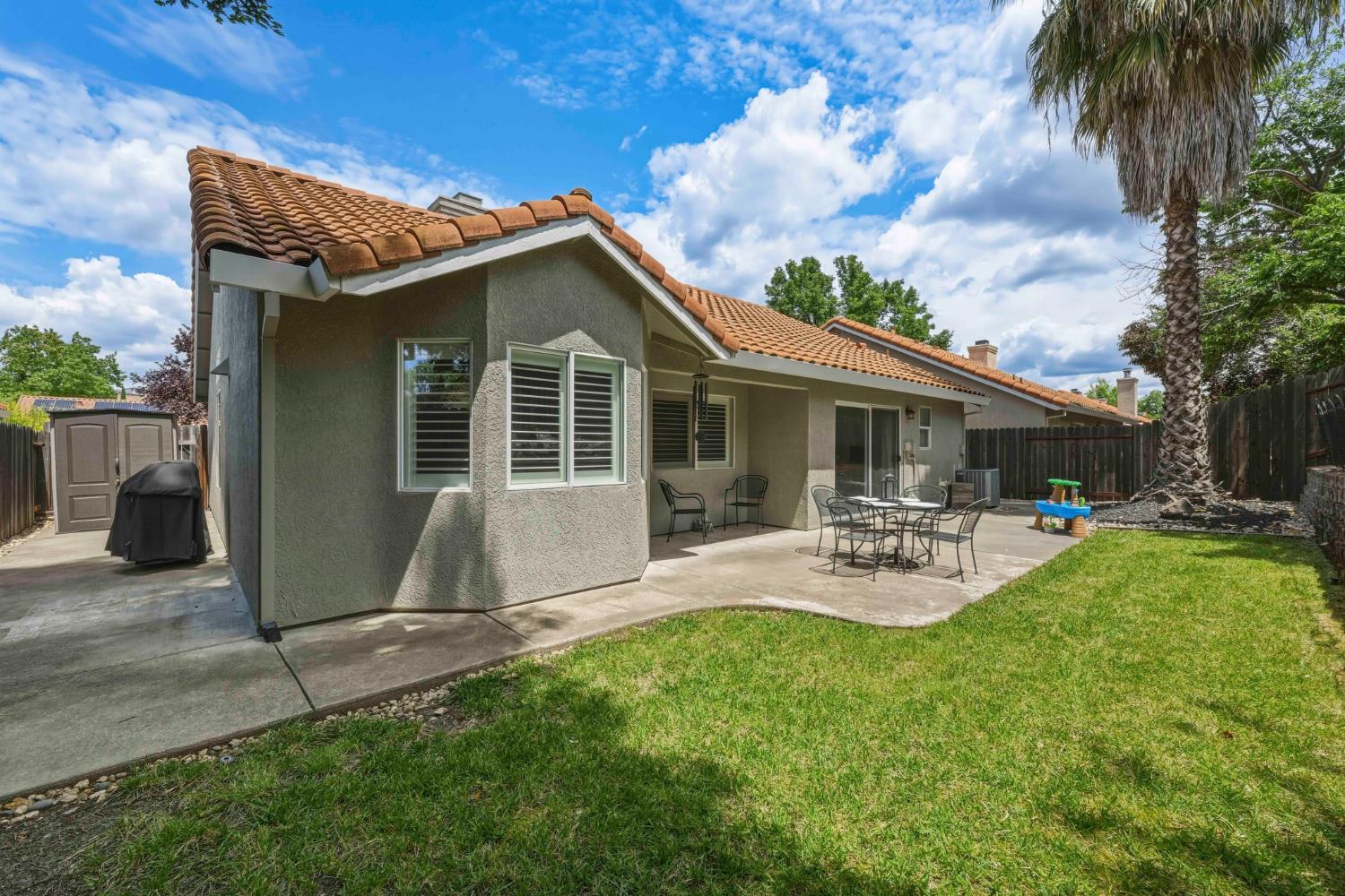 5013 Charter Road Rocklin, CA 95765 - Photo 33 of 35 a view of house with backyard and outdoor seating