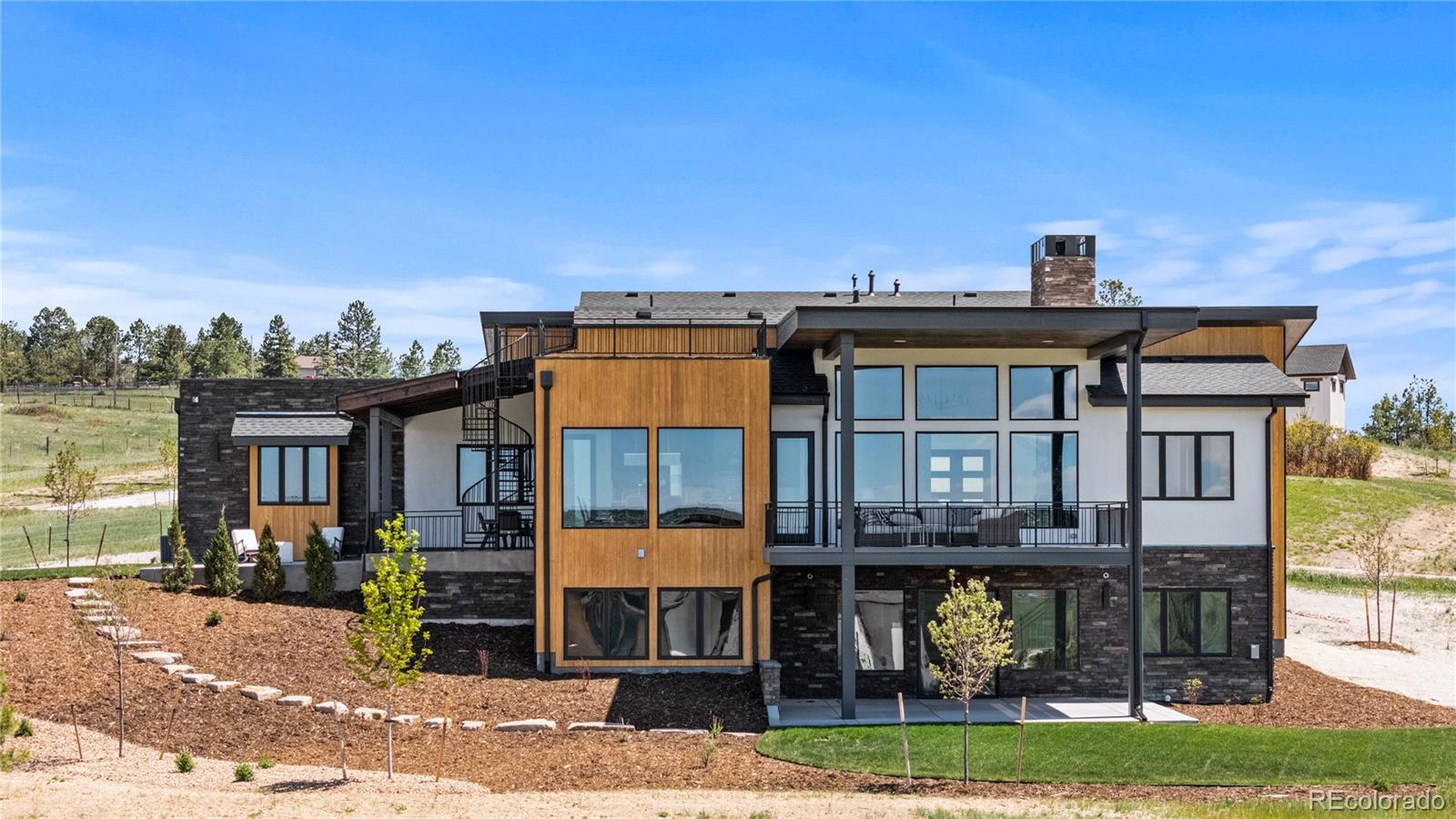 a view of a building with a garden and plants