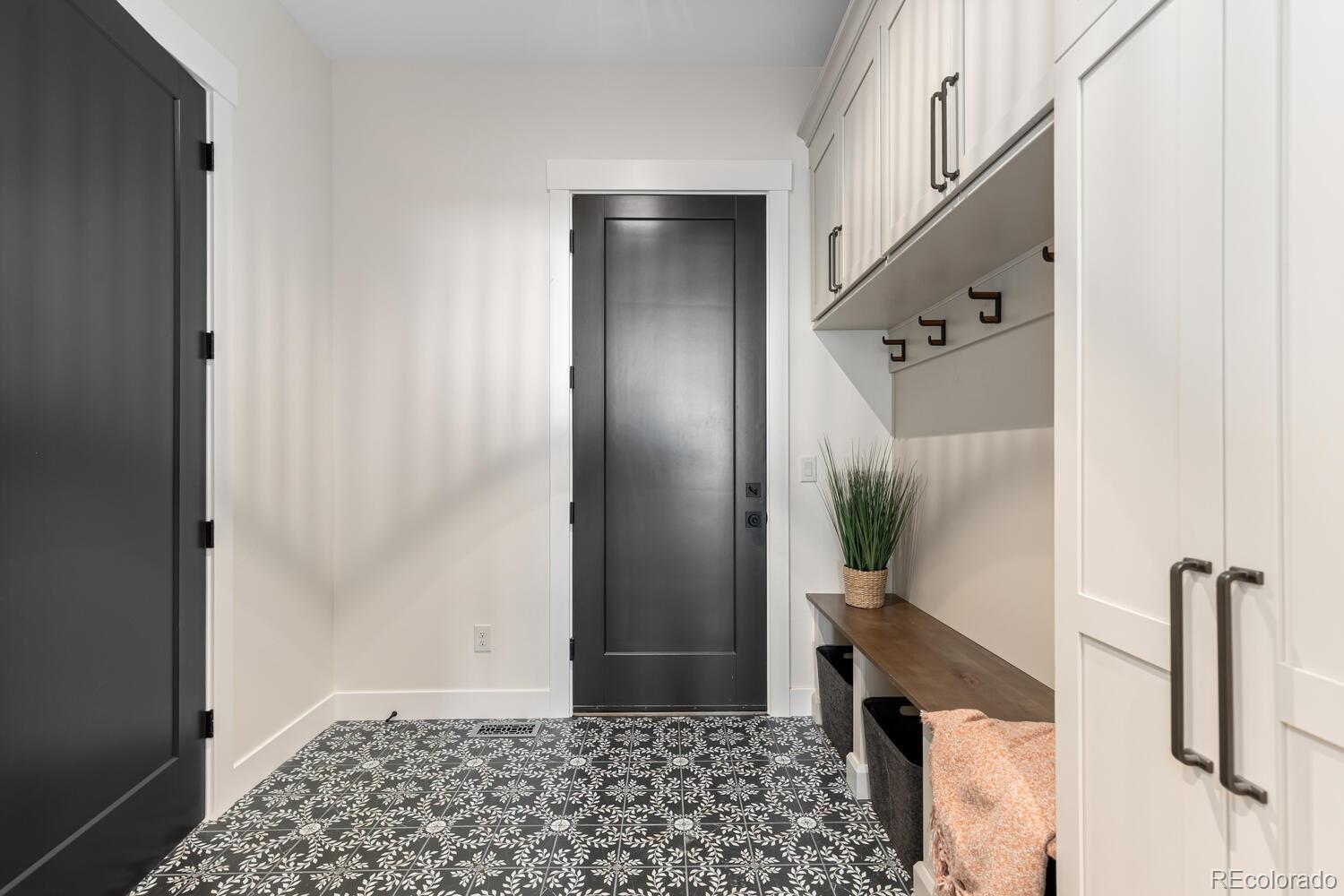 11115 Evening Hunt Road Franktown, CO 80116 - Photo 23 of 46 a bathroom with a shower