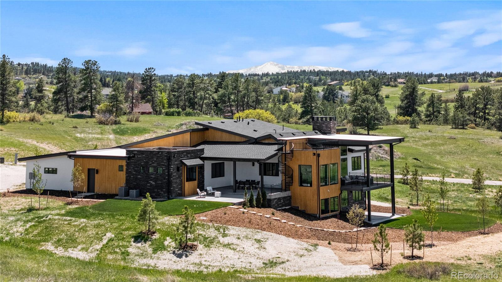 11115 Evening Hunt Road Franktown, CO 80116 - Photo 3 of 46 a view of a house with a yard balcony and furniture