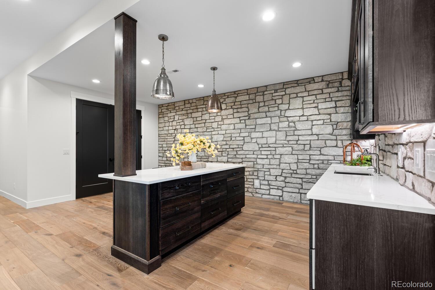 11115 Evening Hunt Road Franktown, CO 80116 - Photo 39 of 46 a bathroom with a sink a vanity and a shower