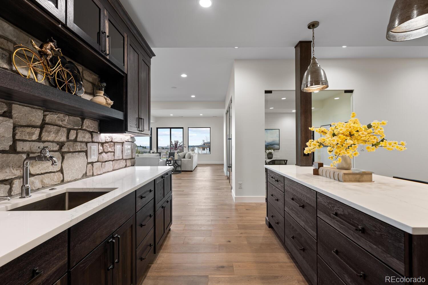 11115 Evening Hunt Road Franktown, CO 80116 - Photo 41 of 46 a kitchen with stainless steel appliances granite countertop a sink and stove