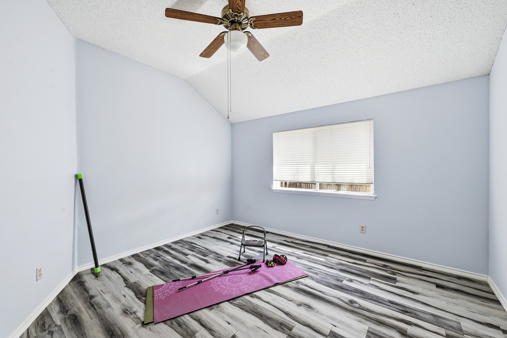 10803 Pinkney Lane Austin, TX 78739 - Photo 20 of 38 Unfurnished room with light wood-style flooring and a ceiling fan