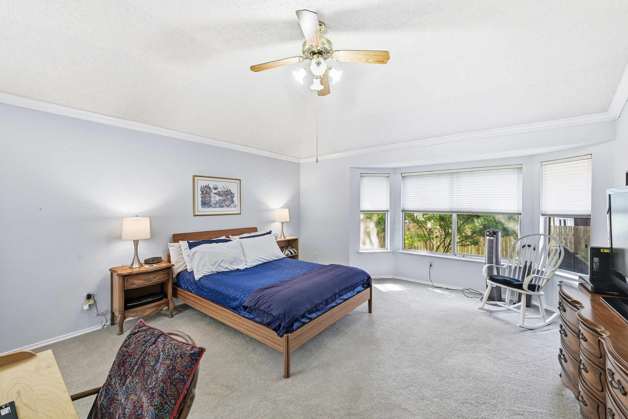 10803 Pinkney Lane Austin, TX 78739 - Photo 22 of 38 Bedroom featuring light carpet, crown molding, and ceiling fan
