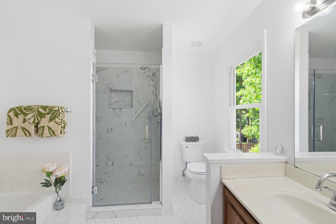 7100 Counter Place Burke, VA 22015 - Photo 32 of 54 Owner’s bath with separate tub and shower