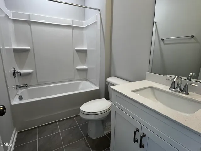 a view of a street with houses on both side