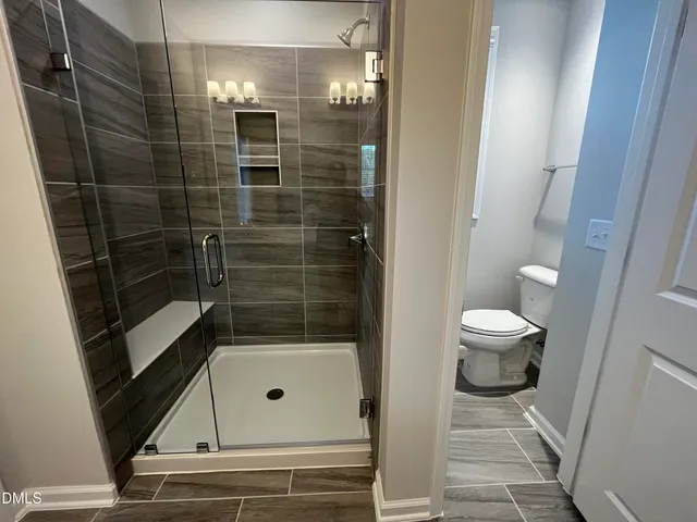 a bathroom with a bathtub and toilet
