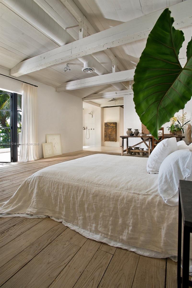 4452 North Bay Road Miami Beach, FL 33140 - Photo 11 of 17 a spacious bedroom with a bed and a large window
