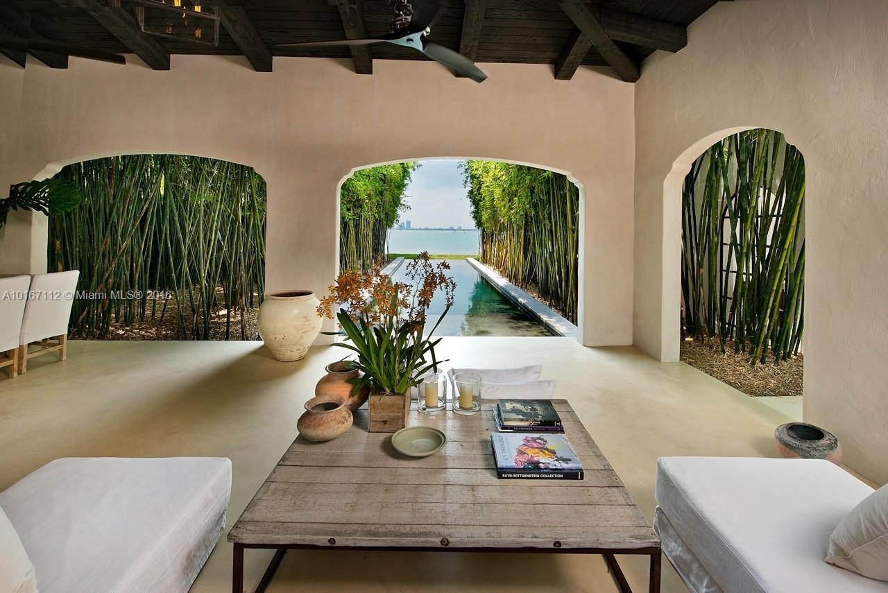 4452 North Bay Road Miami Beach, FL 33140 - Photo 17 of 17 a view of a dining room with furniture and a potted plant