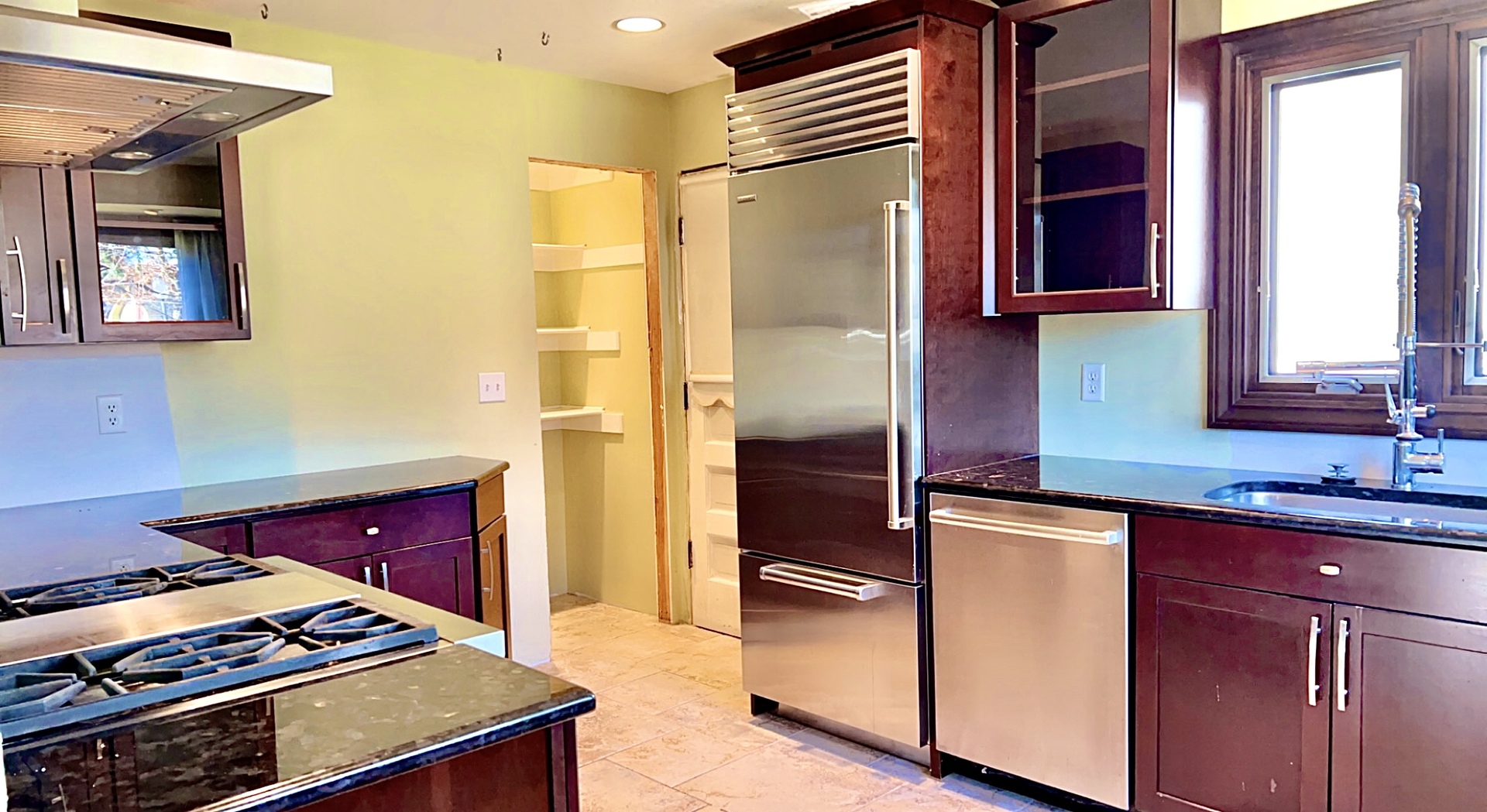 641 North Wright Street Naperville, IL 60563 - Photo 12 of 25 a kitchen with stainless steel appliances granite countertop a stove a sink and a refrigerator