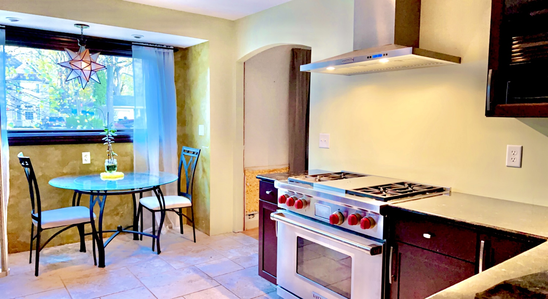 641 North Wright Street Naperville, IL 60563 - Photo 10 of 25 a kitchen with stainless steel appliances granite countertop a stove and a refrigerator