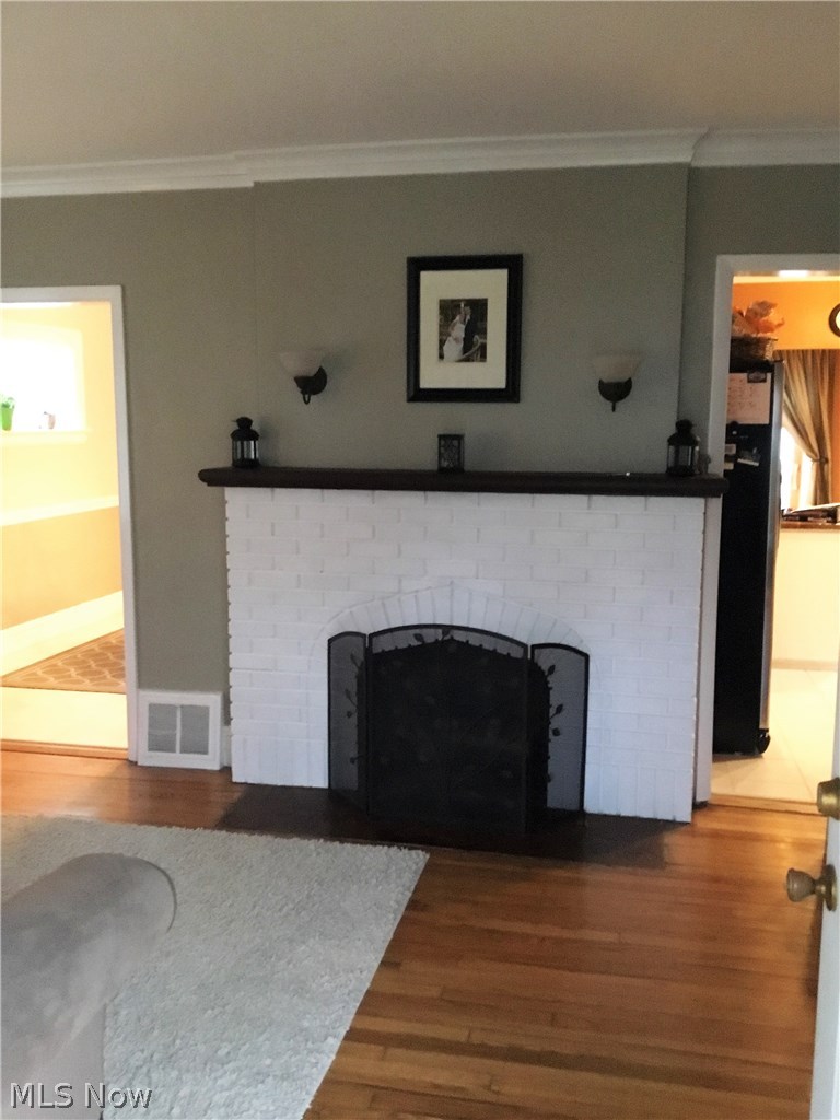 1359 Irene Road Lyndhurst, OH 44124 - Photo 3 of 32 Take a look at this gorgeous fireplace and beautiful hardwood floors.