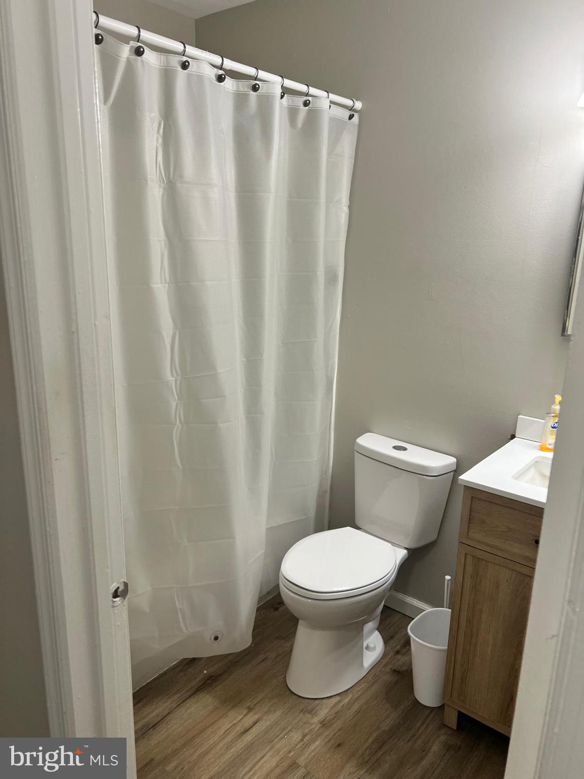 69 Hampshire Road Sicklerville, NJ 08081 - Photo 9 of 12 a white toilet sitting next to a shower curtain
