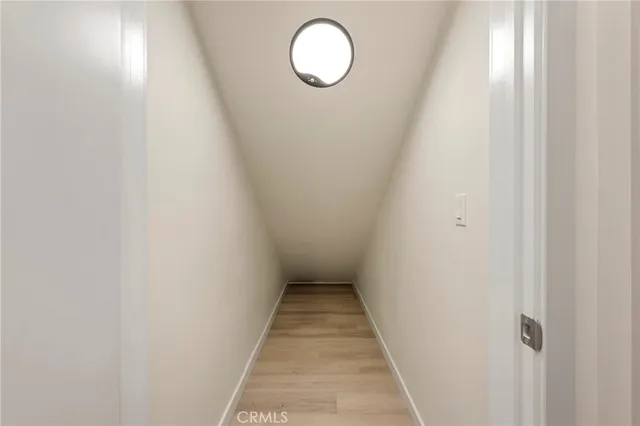 a view of a door and a floor to ceiling window