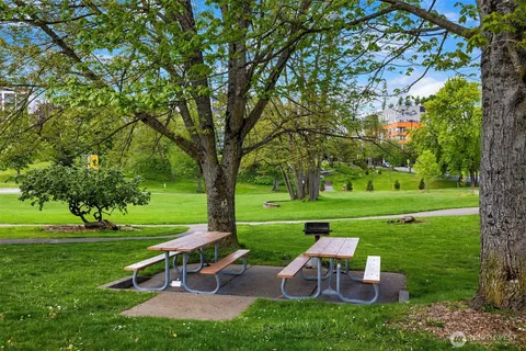 a view of a table and chairs in the garden