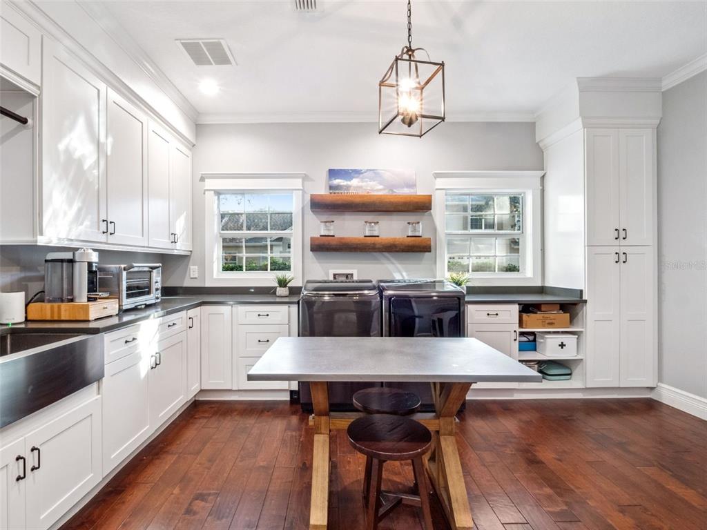 2509 Ridgewind Way Windermere, FL 34786 - Photo 16 of 39 a large kitchen with a table and chairs in it