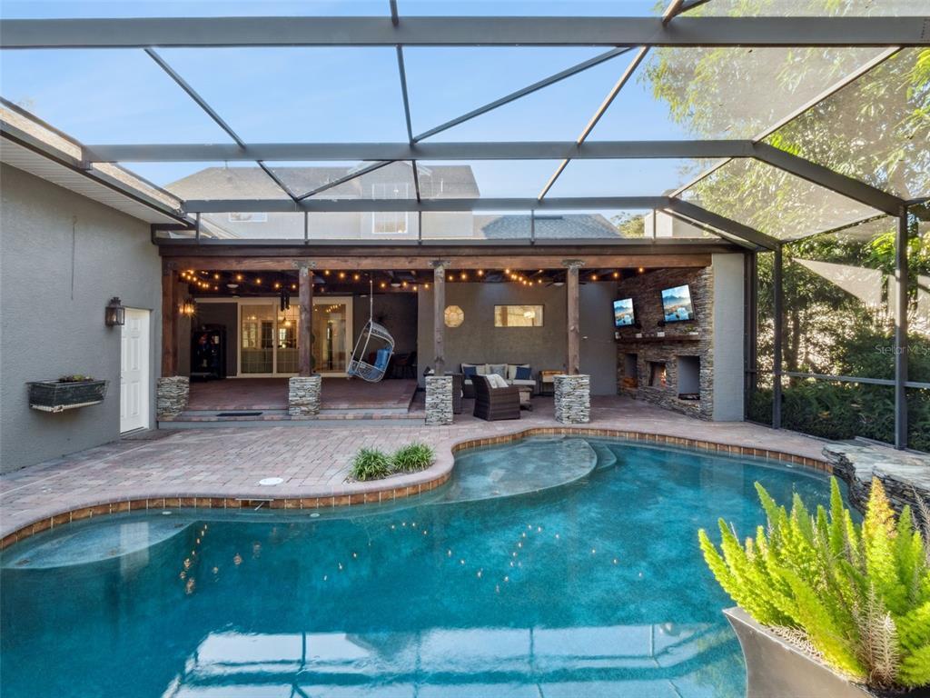 2509 Ridgewind Way Windermere, FL 34786 - Photo 30 of 39 a view of a swimming pool with a patio